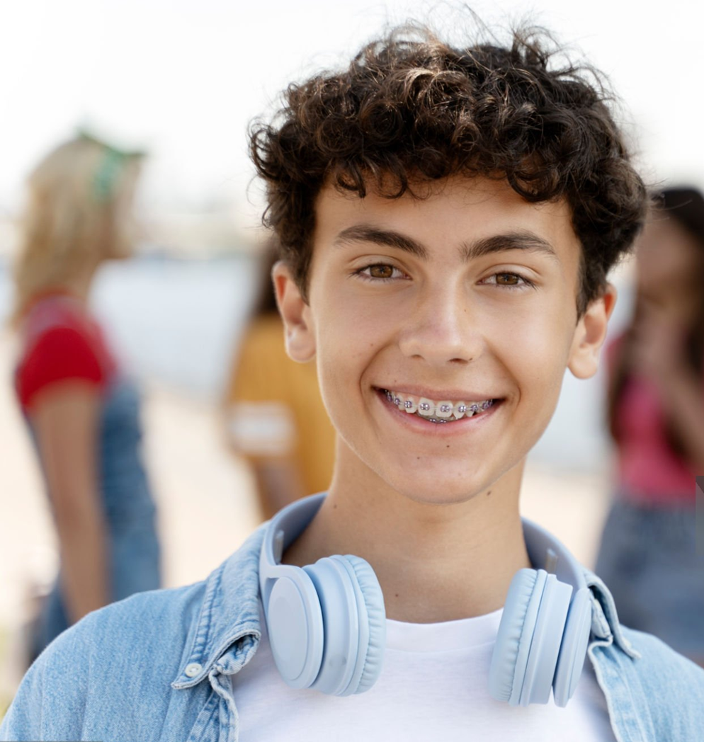 teenage boy curly hair braces